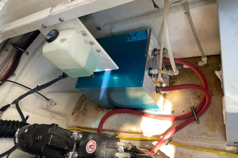 Slide: The Image of Engine compartment of 2007 Chaparral 330 Signature with visible wiring and fluid container. - 30