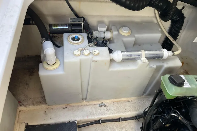 Slide: The Image of 2007 Chaparral 330 Signature boat engine compartment with water tank and filtration system. - 35