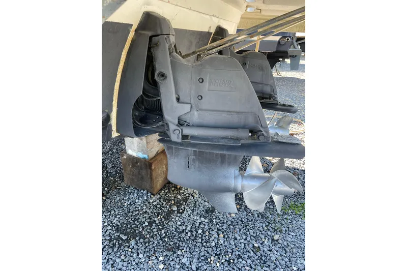 Slide: The Image of 2007 Chaparral 330 Signature boat propellers on gravel surface. - 37