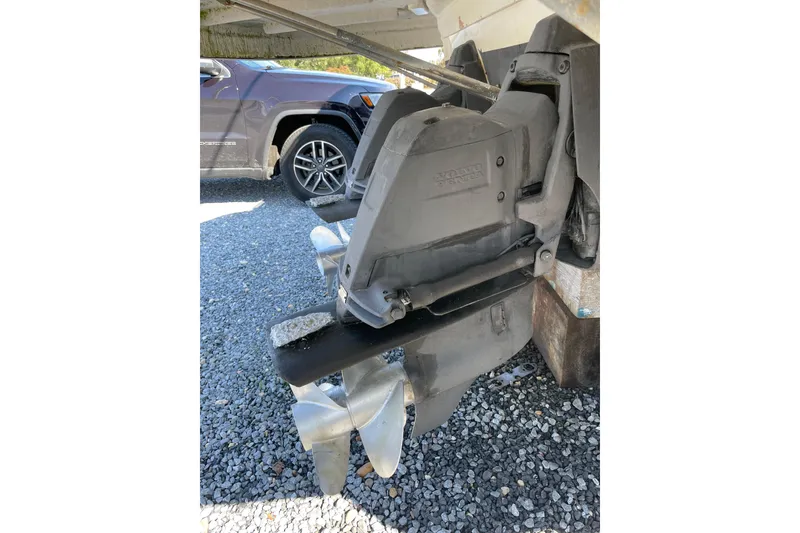 Slide: The Image of 2007 Chaparral 330 Signature boat propeller and drive system on gravel surface. - 38