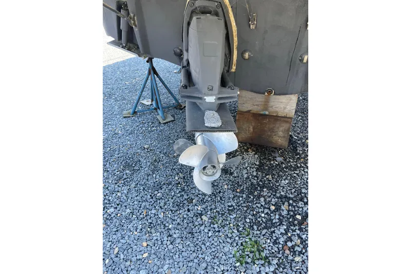 Slide: The Image of 2007 Chaparral 330 Signature boat propeller on gravel surface. - 39