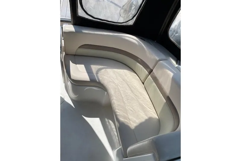 Slide: The Image of 2007 Chaparral 330 Signature boat interior with curved seating and sunlight. - 4