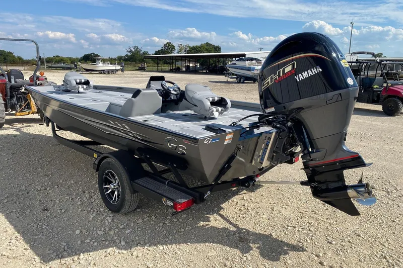 Slide: The Image of 2026 G3 Sportsman 1910SE boat with Yamaha engine on a trailer, parked outdoors. - 3