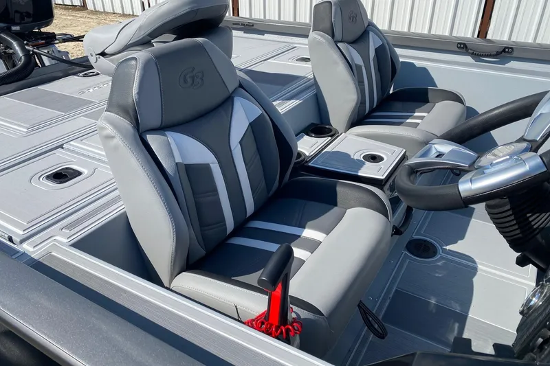 Slide: The Image of 2026 G3 Sportsman 1910SE boat interior with sleek gray seating and modern steering console. - 7
