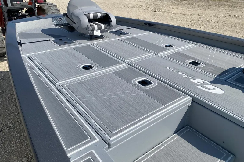 Slide: The Image of 2026 G3 Sportsman 1910SE boat deck with storage compartments and seating. - 8