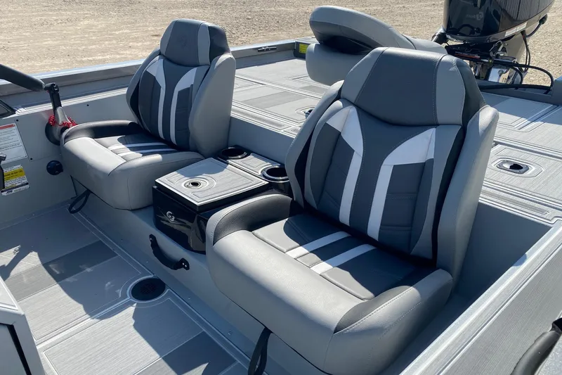 Slide: The Image of 2026 G3 Sportsman 1910SE boat interior with stylish gray seating and console. - 9