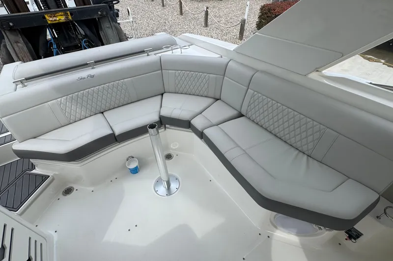Slide: The Image of Luxurious seating area on a 2021 Sea Ray 310 SLX boat, featuring elegant upholstery. - 10