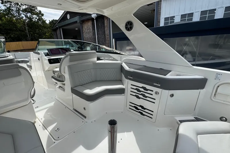 Slide: The Image of 2021 Sea Ray 310 SLX boat interior with luxurious seating and modern design. - 13