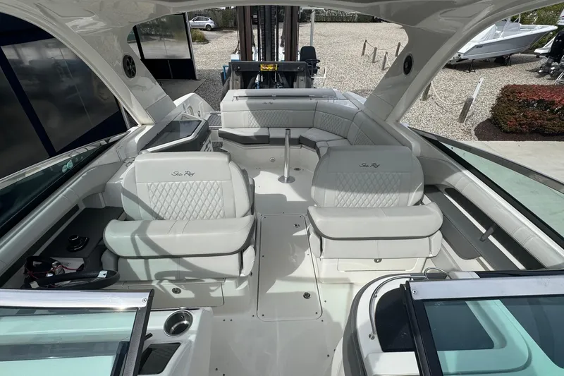 Slide: The Image of 2021 Sea Ray 310 SLX boat interior with luxurious white seating and modern design. - 20