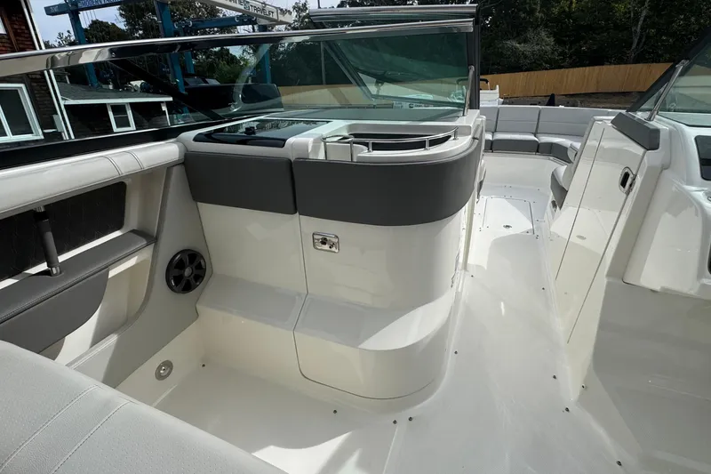 Slide: The Image of 2021 Sea Ray 310 SLX boat interior with sleek seating and modern design. - 21