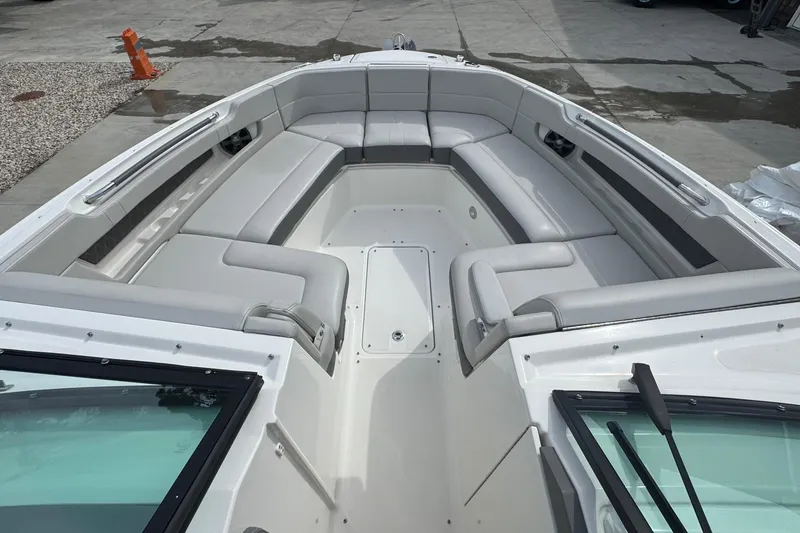 Slide: The Image of 2021 Sea Ray 310 SLX boat with spacious seating and sleek design. - 27