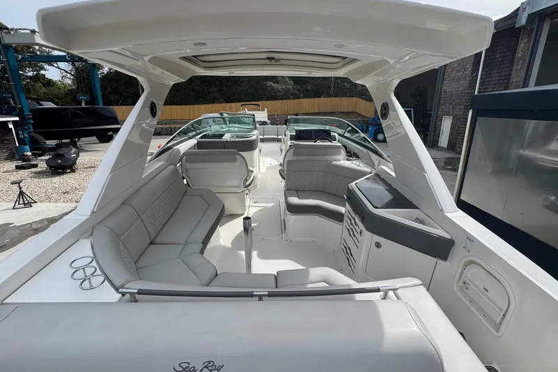 Slide: The Image of 2021 Sea Ray 310 SLX boat interior with spacious seating and modern design. - 7