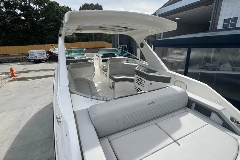 Slide: The Image of 2021 Sea Ray 310 SLX luxury boat interior with spacious seating and modern design. - 8