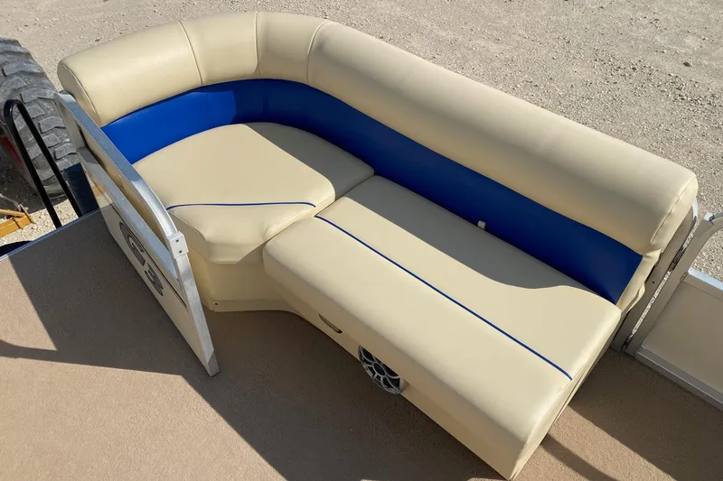 Slide: The Image of 2004 G3 SunCatcher LX 20 Cruise boat seating with beige and blue upholstery. - 7