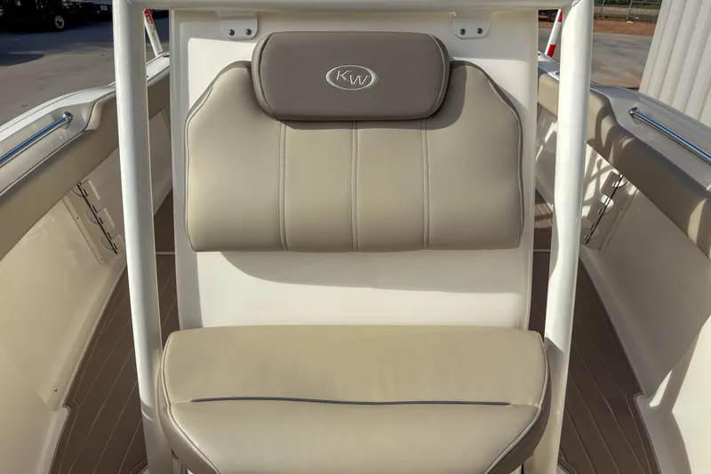 Slide: The Image of 2021 Key West 219 FS boat seat with beige upholstery and KW logo. - 11