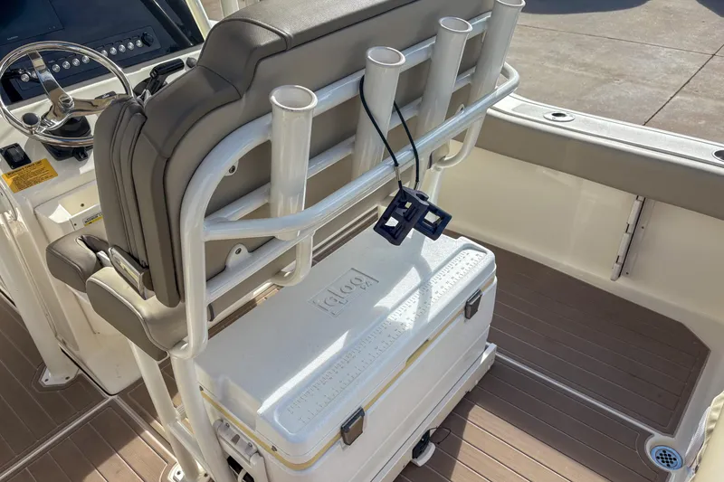 Slide: The Image of 2021 Key West 219 FS boat interior with rod holders and cooler. - 7