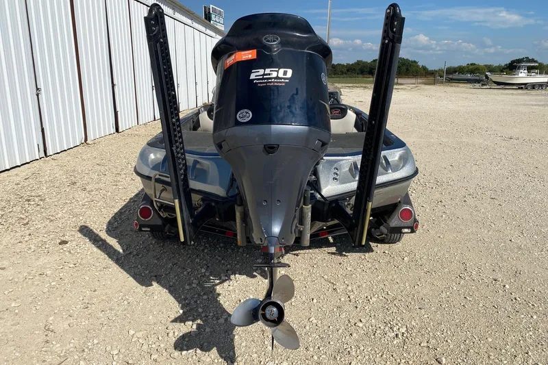 Slide: The Image of 2018 Ranger Z520 Comanche Ranger Cup boat with powerful outboard motor, parked on gravel. - 4