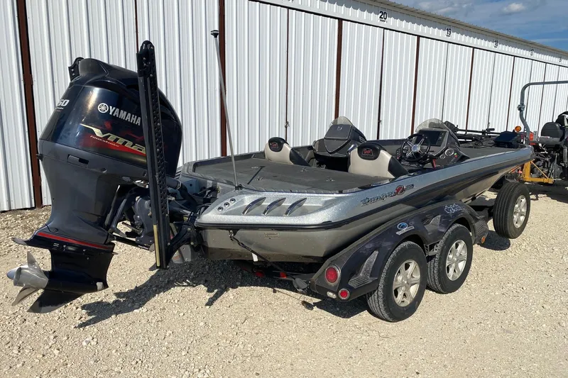 Slide: The Image of 2018 Ranger Z520 Comanche Ranger Cup boat with Yamaha motor, parked outdoors. - 5