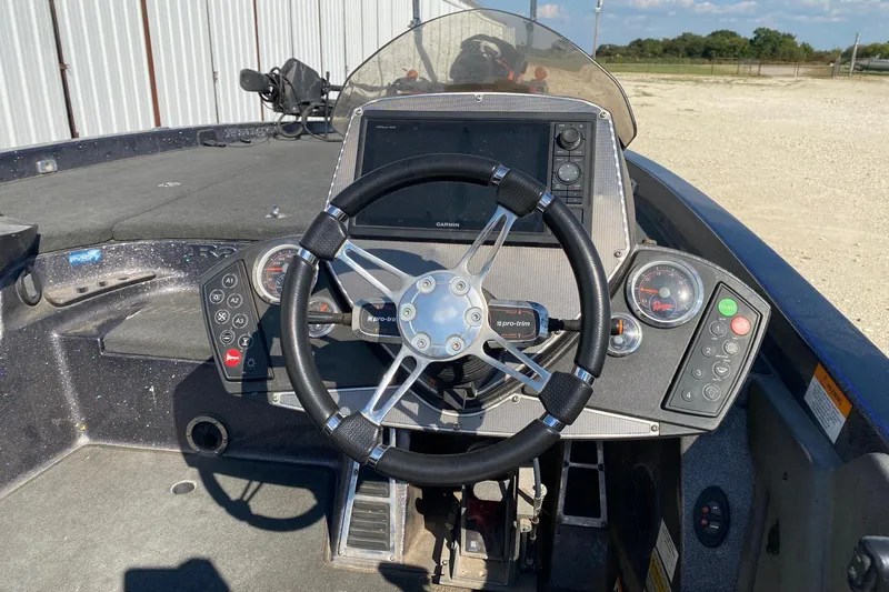 Slide: The Image of 2018 Ranger Z520 Comanche Ranger Cup boat dashboard with steering wheel and controls. - 6
