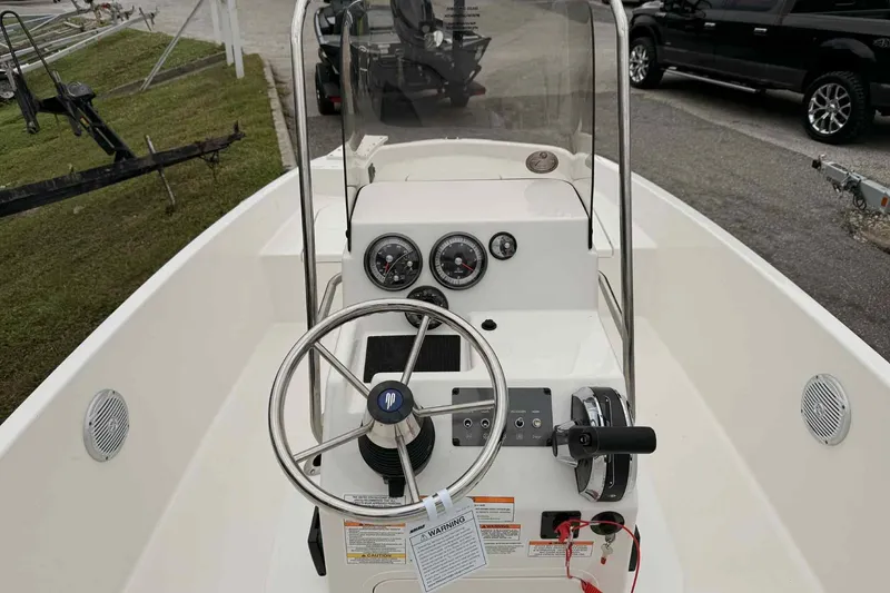 Slide: The Image of 2026 Bayliner Trophy T18 boat dashboard with steering wheel and gauges. - 3