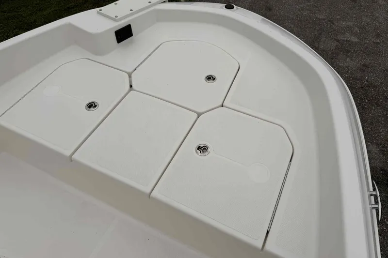 Slide: The Image of 2026 Bayliner Trophy T18 boat deck with storage compartments. - 5