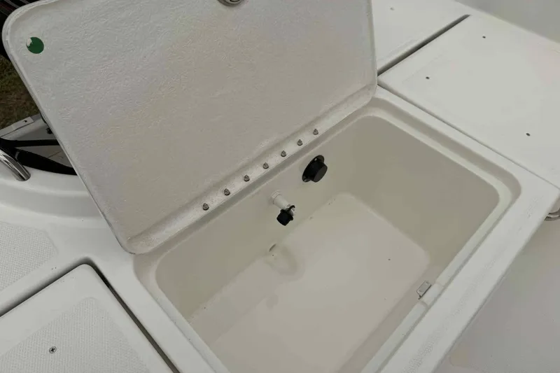 Slide: The Image of Open storage compartment on 2026 Bayliner Trophy T18 boat. - 8