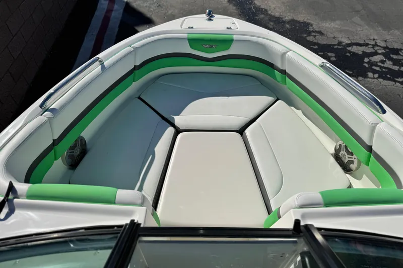 Slide: The Image of 2015 Chaparral Vortex 203 VRX boat interior with green and white seating. - 15