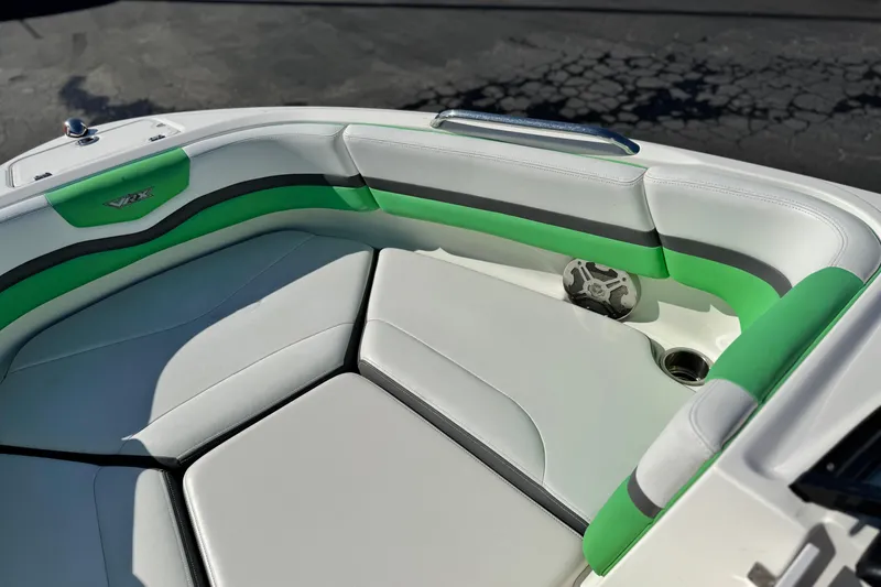 Slide: The Image of 2015 Chaparral Vortex 203 VRX boat interior with green and white seating. - 17