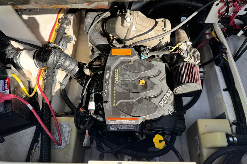Slide: The Image of Engine compartment of a 2015 Chaparral Vortex 203 VRX boat, featuring a Rotax 4-TEC engine. - 21