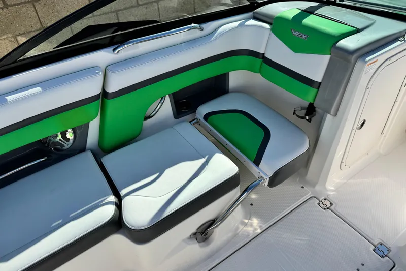 Slide: The Image of 2015 Chaparral Vortex 203 VRX boat interior with green and white seating. - 23