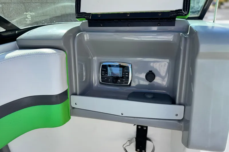 Slide: The Image of 2015 Chaparral Vortex 203 VRX boat interior with control panel and seating. - 24