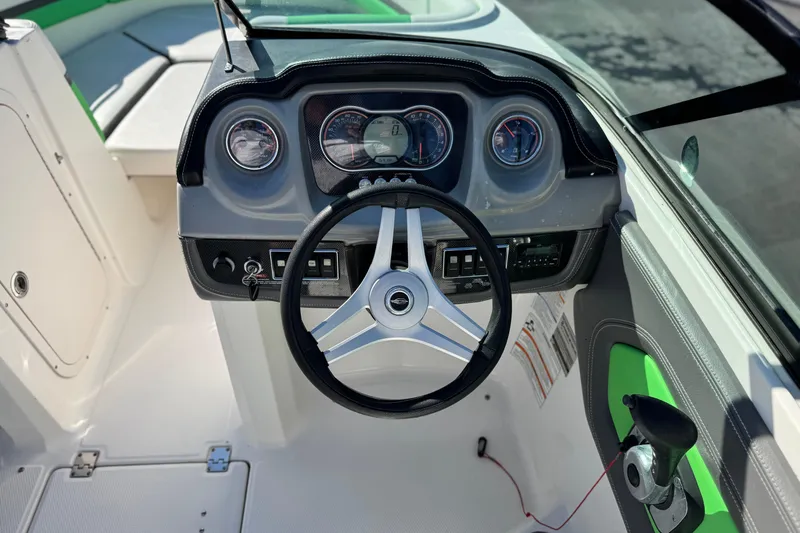 Slide: The Image of 2015 Chaparral Vortex 203 VRX dashboard with steering wheel and instrument panel. - 28