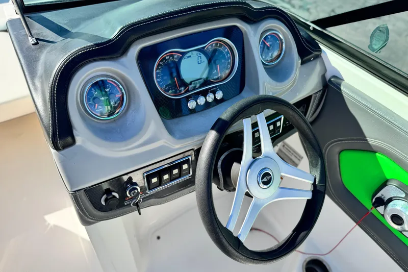 Slide: The Image of Steering console of 2015 Chaparral Vortex 203 VRX boat with gauges and controls. - 29