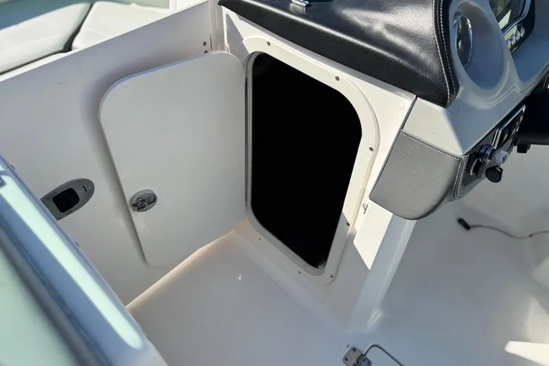 Slide: The Image of 2015 Chaparral Vortex 203 VRX boat interior storage compartment. - 30