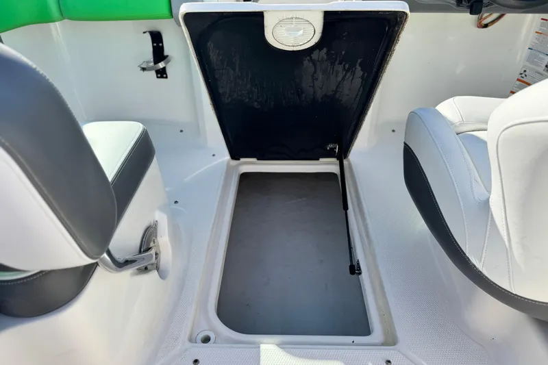 Slide: The Image of 2015 Chaparral Vortex 203 VRX interior storage compartment with open hatch. - 31