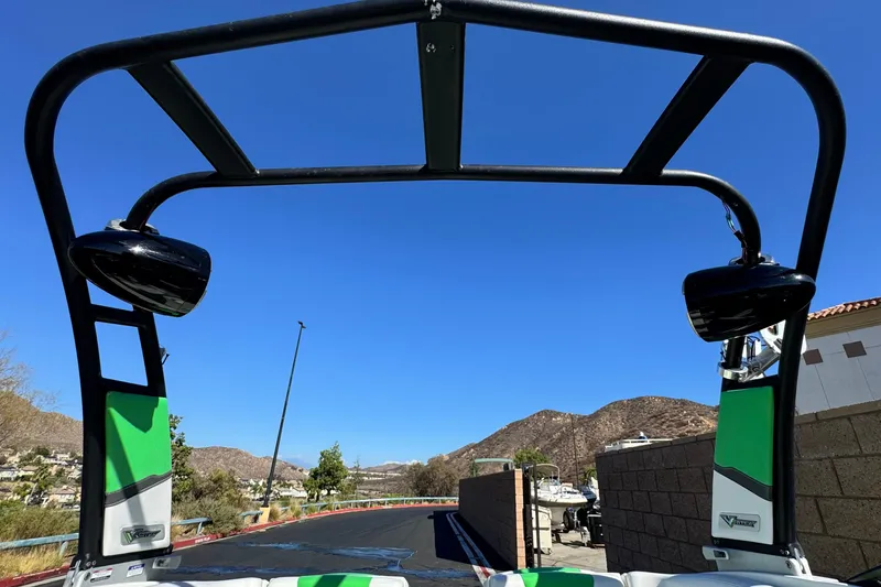 Slide: The Image of 2015 Chaparral Vortex 203 VRX boat with wakeboard tower, against a clear blue sky. - 9