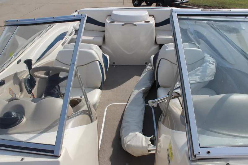 Slide: The Image of 2002 Bayliner 1950 Capri Classic boat interior with seating and steering wheel. - 19