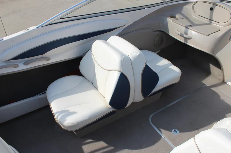 Slide: The Image of 2002 Bayliner 1950 Capri Classic boat interior with white and blue seating. - 20