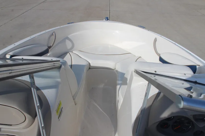 Slide: The Image of 2002 Bayliner 1950 Capri Classic boat interior with seating and dashboard view. - 23