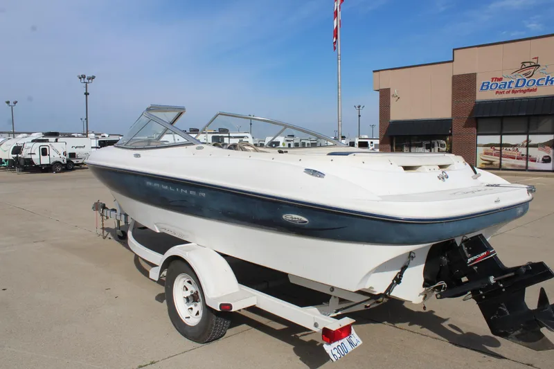 Slide: The Image of 2002 Bayliner 1950 Capri Classic boat on trailer at dealership lot. - 7