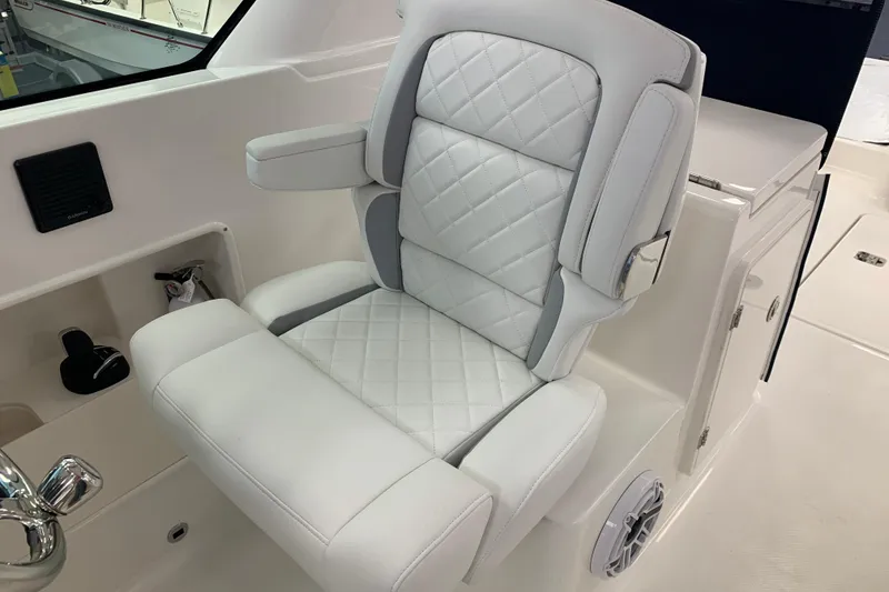 Slide: The Image of Luxurious white seat on 2025 Pursuit DC 266 Dual Console boat. - 18