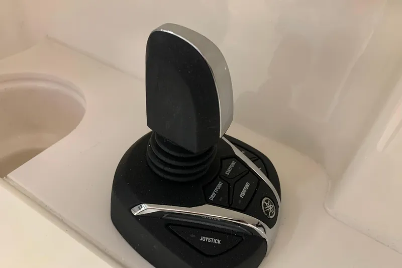 Slide: The Image of Joystick control on 2025 Pursuit DC 266 Dual Console boat. - 19