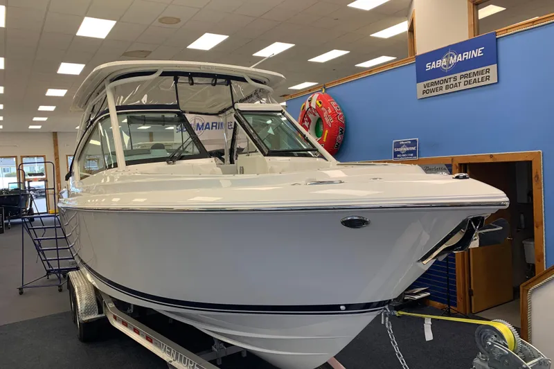 Slide: The Image of 2025 Pursuit DC 266 Dual Console boat displayed at Saba Marine dealership. - 4