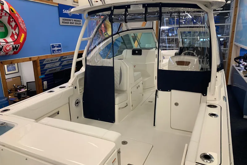 Slide: The Image of 2025 Pursuit DC 266 Dual Console boat interior at a Vermont dealership. - 8