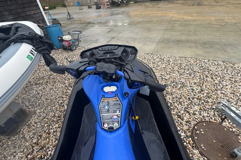 Slide: The Image of 2023 Sea-Doo Spark Trixx jet ski parked on gravel surface. - 9