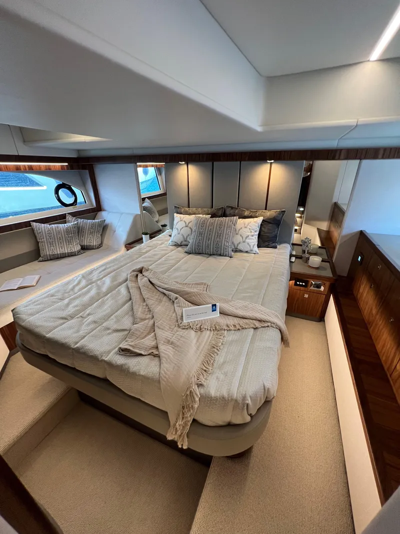 Slide: The Image of Luxurious bedroom interior of 2022 Riviera 505 SUV yacht with elegant bedding and modern design. - 38