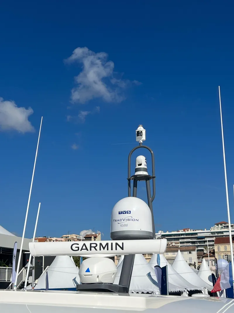 Slide: The Image of Riviera 505 SUV 2022 yacht with Garmin navigation equipment against a clear blue sky. - 49