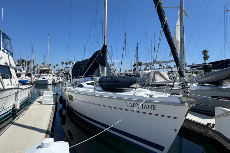 The Image of Sailboat "Lady Jane" docked, 1999 Hunter Passage 420, marina setting, clear blue sky. - 0