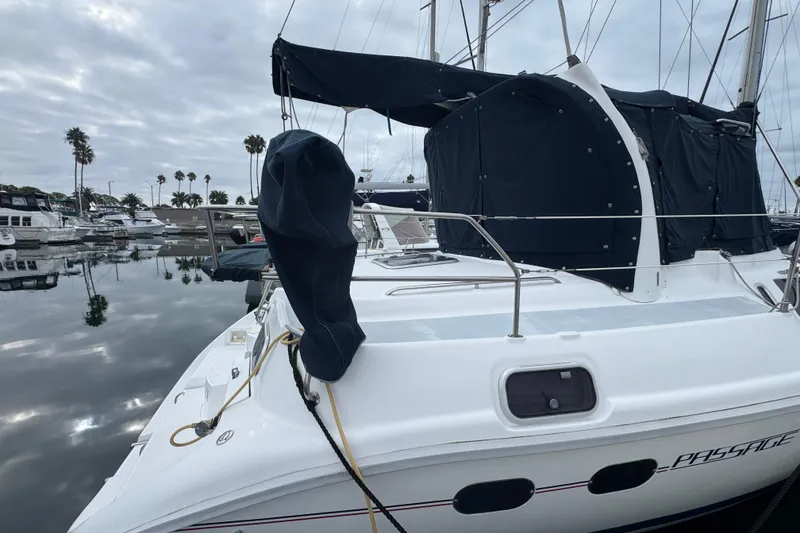 Slide: The Image of 1999 Hunter Passage 420 sailboat docked in a marina with overcast skies. - 10