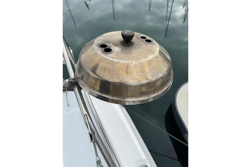 Slide: The Image of Metallic dome on 1999 Hunter Passage 420 sailboat, reflecting water and sky. - 14
